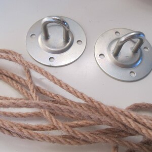 May include: Two silver metal ceiling hooks with a rope for hanging a hammock or swing.