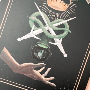 detail of the daggers, snake,couldron and hand