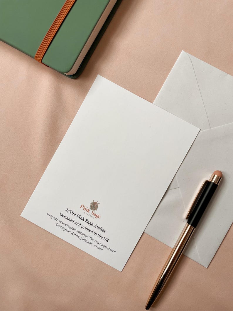 The back of the postcard shows the designer's logo and contact details.
Also shows a white envelope that is included.