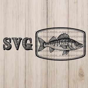 May include: Black and white illustration of a fish inside a rectangular frame, with the letters "SVG" to the left. The fish has detailed scales and fins. The background is a light wood grain.