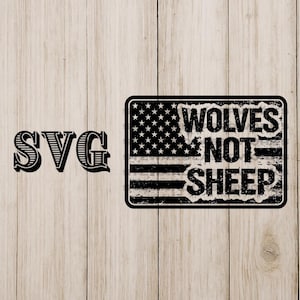 May include: Black and white SVG design. The left side features the text "SVG". The right side shows a rectangular graphic with a distressed American flag design and the words "WOLVES NOT SHEEP".