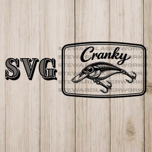 May include: Black and white SVG design featuring the word "SVG" in a bold, vintage font. A rectangular graphic with the word "Cranky" and a detailed fishing lure illustration is also present. The design is set against a light wood grain background.