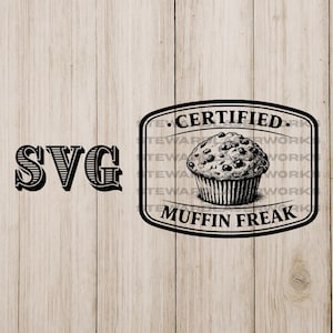 May include: Black and white SVG graphic with the text "SVG" on the left. On the right is a black and white illustration of a muffin inside a frame that says "CERTIFIED MUFFIN FREAK". The background is a light wood grain.