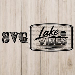 May include: Black and white SVG design with the text "SVG" on the left and a rectangular graphic on the right. The graphic reads "Lake Vibes" with a sun, mountains, and water design.