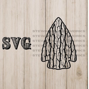 May include: Black SVG graphic of an arrowhead with a textured pattern, next to the word "SVG" in a decorative font. The design is set against a light brown, wood-grain background.