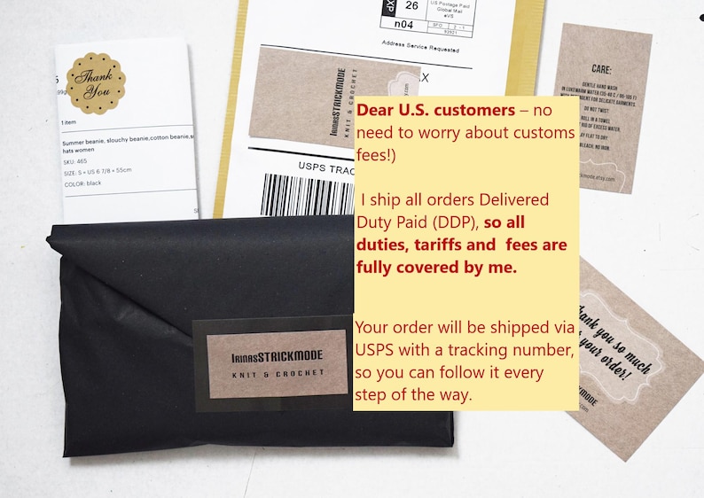 May include: A black paper-wrapped package featuring a rectangular label with the text IrinasStrickmode Knit & Crochet. Included are several paper inserts, including a Thank You sticker, a care instruction card, and a shipping envelope.