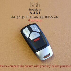 May include: Black remote car key with four buttons, labeled "Panic". Suitable for Audi A4, Q7, Q5, TT, A3, A6, SQ5, R8, S5, etc.