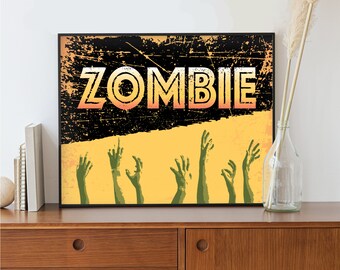 May include: A black and yellow vintage-style poster with the word "ZOMBIE" in large, bold letters. The poster features several green zombie hands reaching up from the bottom.