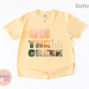 Vintage inspired Comfort Colors unisex t-shirt with coastal creek sunset artwork, popular 90s nostalgia aesthetic graphic tee. Dawson's Creek