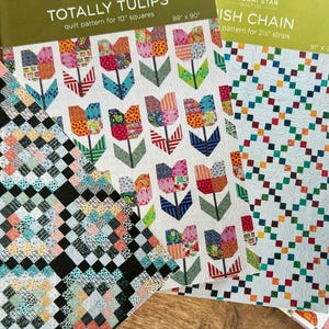 Op de afbeelding: Vier quiltpatronen te koop. De patronen zijn getiteld "Crossing Paths", "Totally Tulips", "Dish Chain" en "Itty Bitty Kitty Commotion".