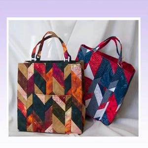 May include: Two quilted tote bags, one with a red, orange, and brown geometric pattern and the other with a red, blue, and white geometric pattern. The bags are 12 inches high, 12 inches wide, and 6 inches deep. "Take It Anywhere Tote" and "Designed by Georgette Dell'Orco" are written above the bags.