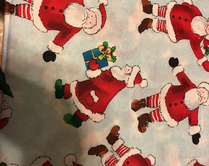 Santa on Ice 100% cotton fabric, sold by the yard   #566