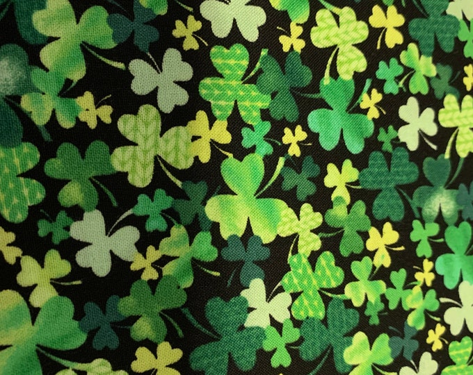 Clover on Black 100% cotton fabric, sold by the yard