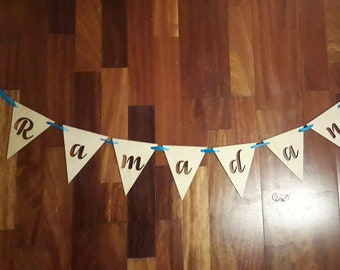 Garland wooden letters hanging on ribbon. Ramadan, Eid, Mubarak, Happy, Eid Al Fitr Adha, Birthsday, custom writing