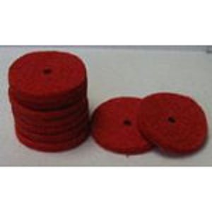 May include: A stack of ten red felt polishing pads, with three additional pads in the foreground. The pads are round and have a small hole in the center.