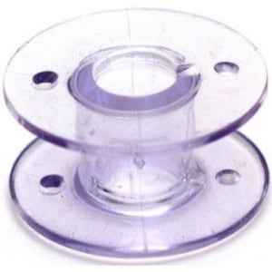 May include: A clear plastic bobbin for a sewing machine.