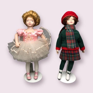 Set of 2 Avon Porcelain Dolls - 1991 Childhood Dreams Ballet Recital and 1991 Skating Party with Stands