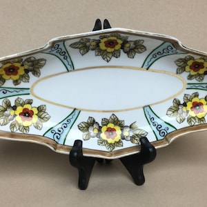 Noritake Plato de apio para pepinillos Ribete marrón dorado Patrón de margaritas Borde festoneado Asas recortadas
