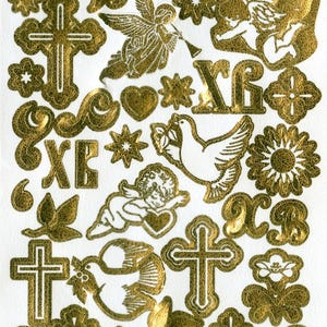 Könnte beinhalten: Goldfolienaufkleber mit religiösen Symbolen, darunter Kreuze, Engel, Tauben und florale Designs. Die Aufkleber enthalten auch kyrillischen Text. Die Aufkleber befinden sich auf weißem Hintergrund.