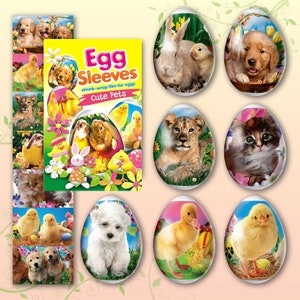 Puede incluir: Un paquete de "Egg Sleeves", film retráctil para huevos, con el texto "Cute Pets". La imagen muestra huevos decorados con cachorros, gatitos, conejitos, patitos y un cachorro de león. Los huevos son ovalados y tienen un acabado brillante.