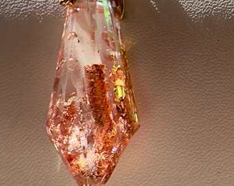 Handcrafted glow pendant. Unique floating, light-catching shine.  Real gold chain.  Limited holiday pieces.