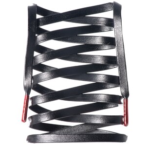 May include: Black leather shoelaces with red tips, woven into a criss-cross pattern.