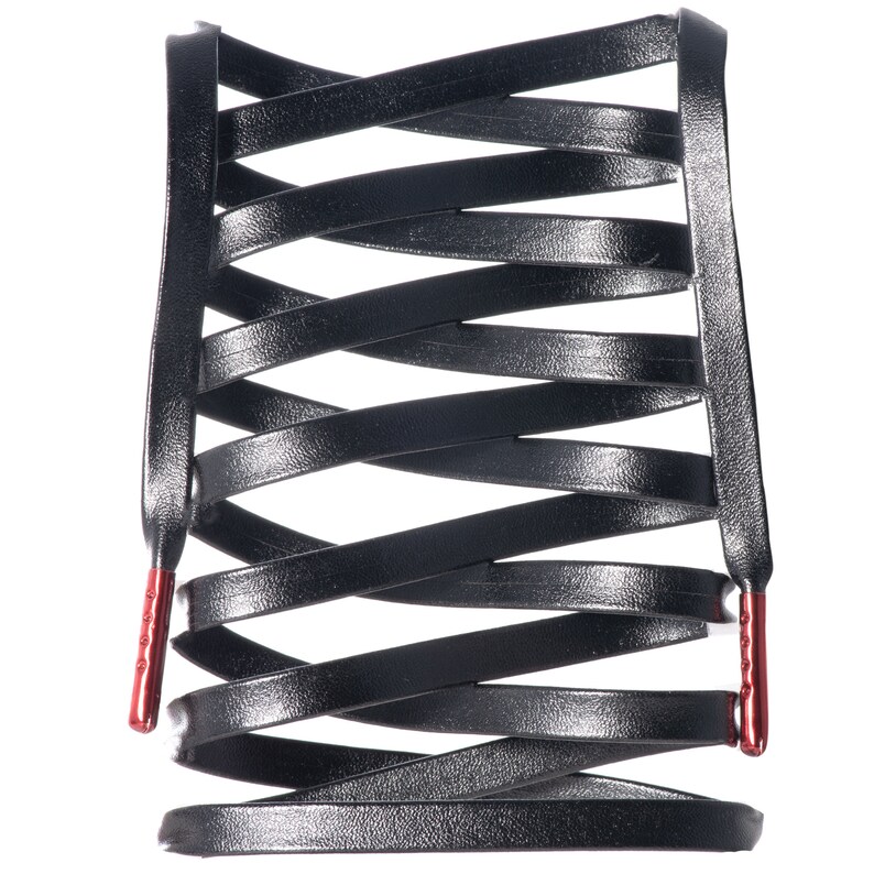 May include: Black leather shoelaces with red tips, woven into a criss-cross pattern.