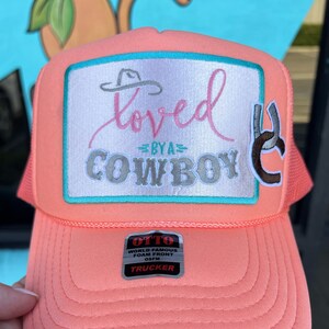 loved by a cowboy patch hat, only one available - coral trucker Hat