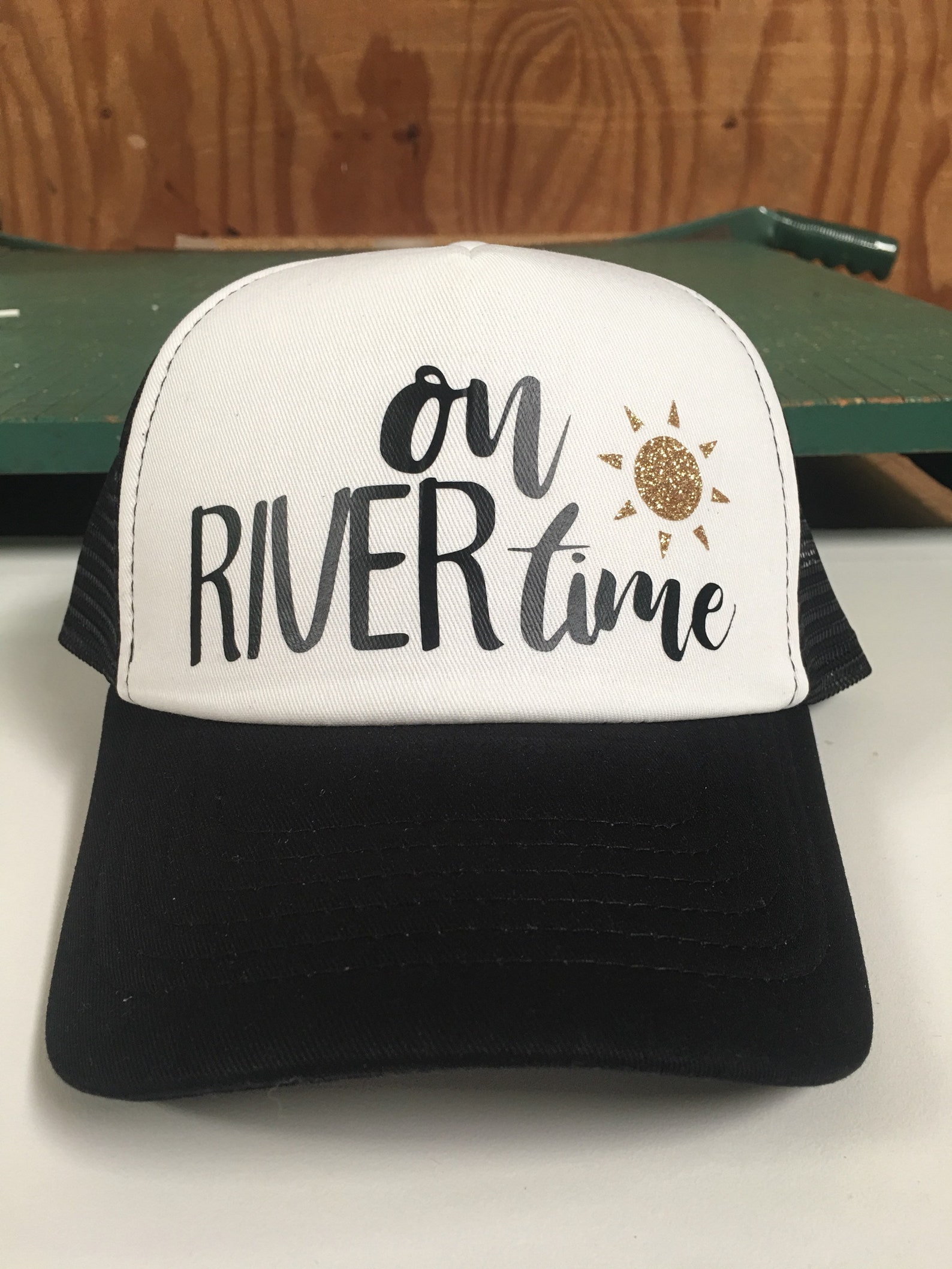 The White Drink On The River Trucker Hat