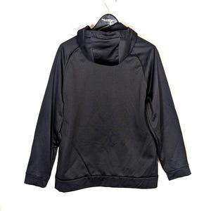 May include: A black hooded sweatshirt with a drawstring hood and long sleeves. The sweatshirt is hanging on a white background. The Polo Sport logo is visible on the hanger.