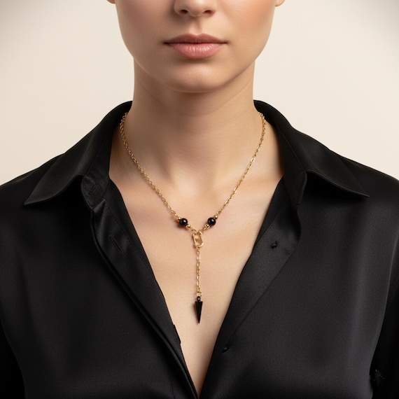 Collier pendule en acier inoxydable doré et onyx noir