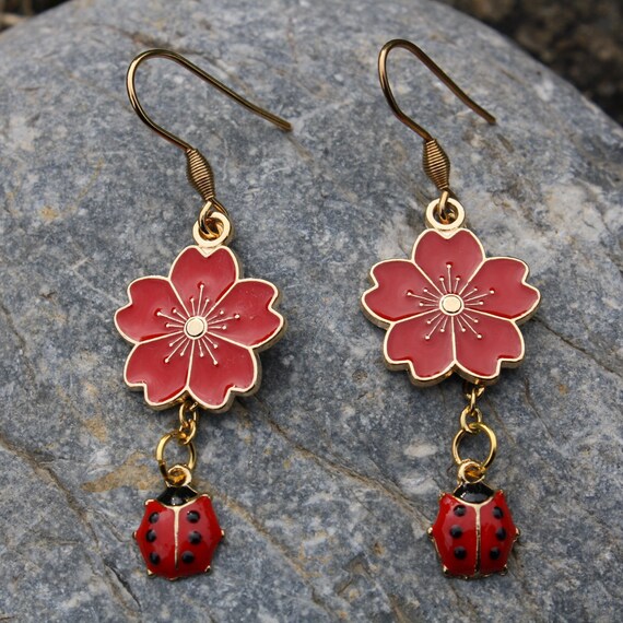 Flower and ladybug earrings