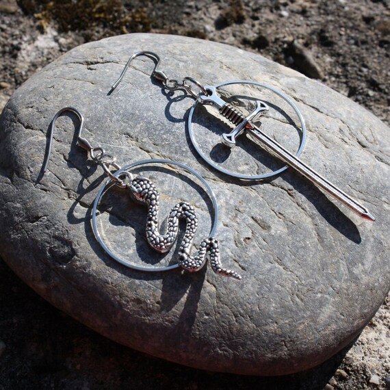 Mismatched sword and snake earrings