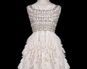 Oleg Cassini dress 1950s 1960s vintage prom wedding gown beaded ivory lace ruffles rhinestones sleeveless big skirt couture bridal reception