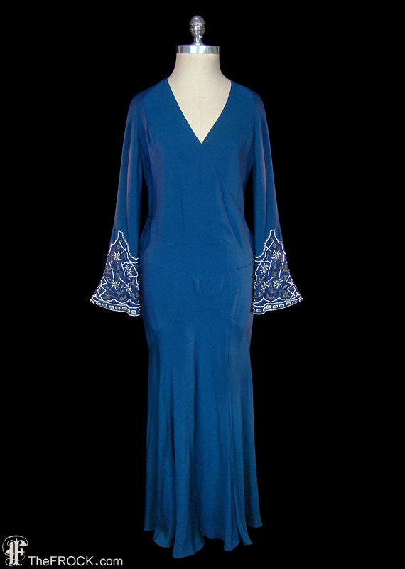 Flapper era dress, 1920s art-deco gown, beaded blu