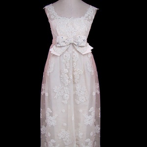 Lace wedding dress, 1950s /1960s tea length, sleeveless, with pearl bead and rhinestone jeweled bow, demure princess style