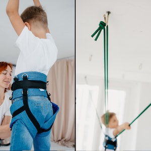 Pode incluir: Um arn&ecirc;s de ganga azul com al&ccedil;as pretas ajust&aacute;veis e an&eacute;is em D de metal. O arn&ecirc;s possui uma cintura larga e al&ccedil;as para as pernas para suporte. Cordas verdes longas est&atilde;o presas ao arn&ecirc;s e conectadas a um gancho de teto.