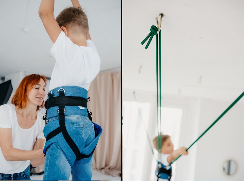 Pode incluir: Um arn&ecirc;s de ganga azul com al&ccedil;as pretas ajust&aacute;veis e an&eacute;is em D de metal. O arn&ecirc;s possui uma cintura larga e al&ccedil;as para as pernas para suporte. Cordas verdes longas est&atilde;o presas ao arn&ecirc;s e conectadas a um gancho de teto.