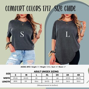 May include: A Comfort Colors 1717 size guide featuring two charcoal grey t-shirts labeled S and L. The graphic includes a sizing chart with width and length measurements in inches for sizes S through 4X, and model info stating height 5'4, weight 120lbs, bust 54, and waist 27.