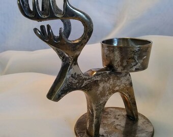 Metal reindeer taper candle holders at Aldi! These would look so awesome on a mantle or as table centerpieces