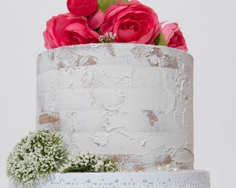 Fake farmhouse white cake lightly frosted