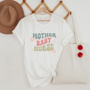 Mother baby nurse shirt, Nurse svg png, Pediatric Nurse, Nurse Practitioner gift, Nicu Nurse Shirt svg, Swaddle Specialist, Popular svg