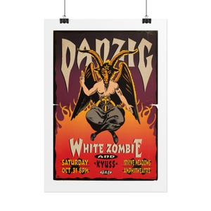 May include: A concert poster featuring the text Danzig, White Zombie, and Kyuss. The artwork displays a central horned figure with wings, a pentagram on its forehead, and a snake around its waist, set against a background of orange and red flames.
