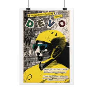 May include: A concert poster for DEVO at Merriweather Post Pavilion on July 27, 1980. The graphic features a stylized figure in a yellow helmet and blue glasses. Text includes event details, ticket prices of $9.50 and $7.00, and venue info.