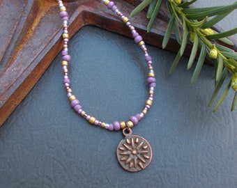 Bronze Sun Medallion Necklace: Mauve Seed Bead Chain
