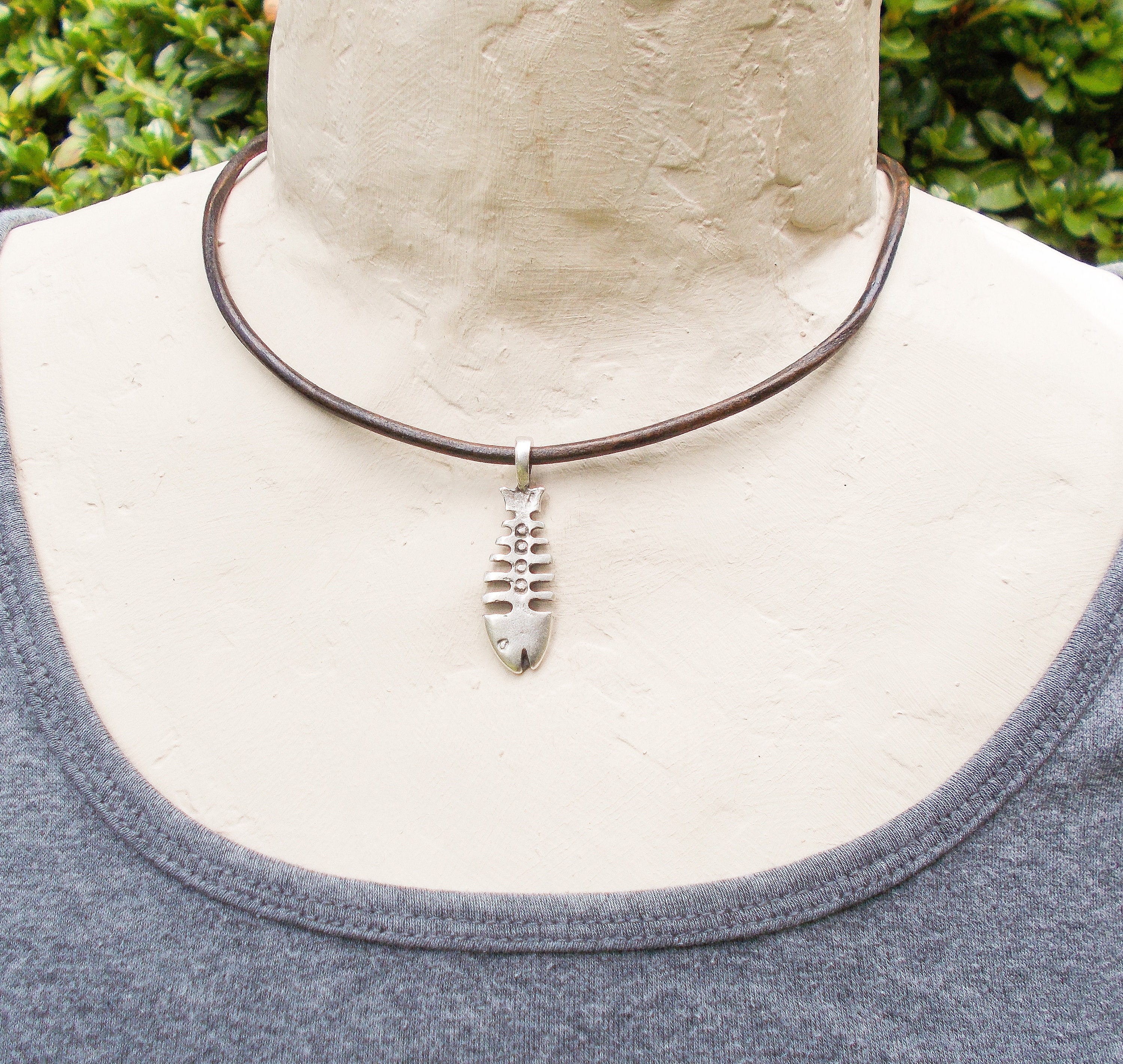 Necklace - string and metal pendant, patinous fish skeleton