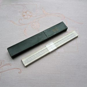 Vintage logarithmic ruler (#1). Collectible logarithmic engineering ruler. Calculating ruler