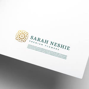 May include: A gold floral design logo with the text "SARAH NESHIE PREMIUM FLOWERS" in dark green below it. The text is set in a serif font.