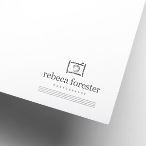 May include: A black and white logo for a photography business called "rebeca forester photography". The logo features a stylized camera icon.