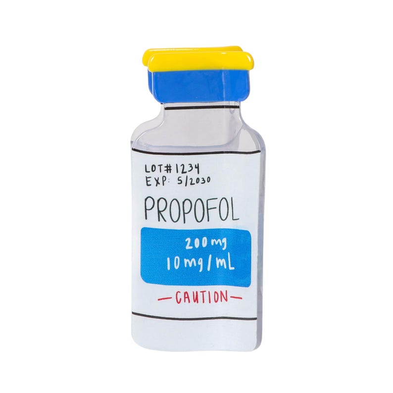 May include: A clear glass vial with a yellow and blue cap, featuring a white label with black text reading LOT# 1234, EXP: 5/2030, PROPOFOL, and a blue rectangular section with white text 200mg 10mg/mL, plus the red text CAUTION at the bottom.